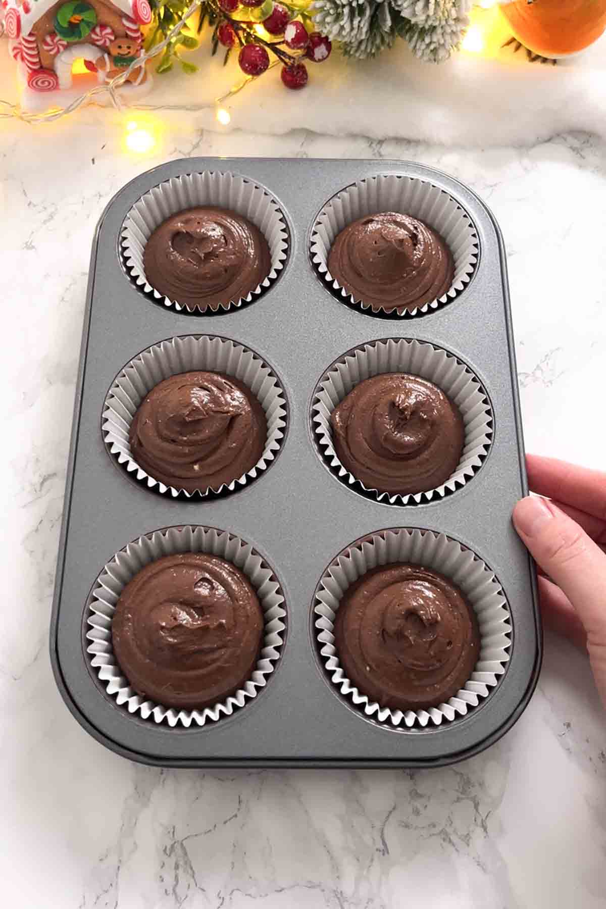 cupcake batter in cupcake tin