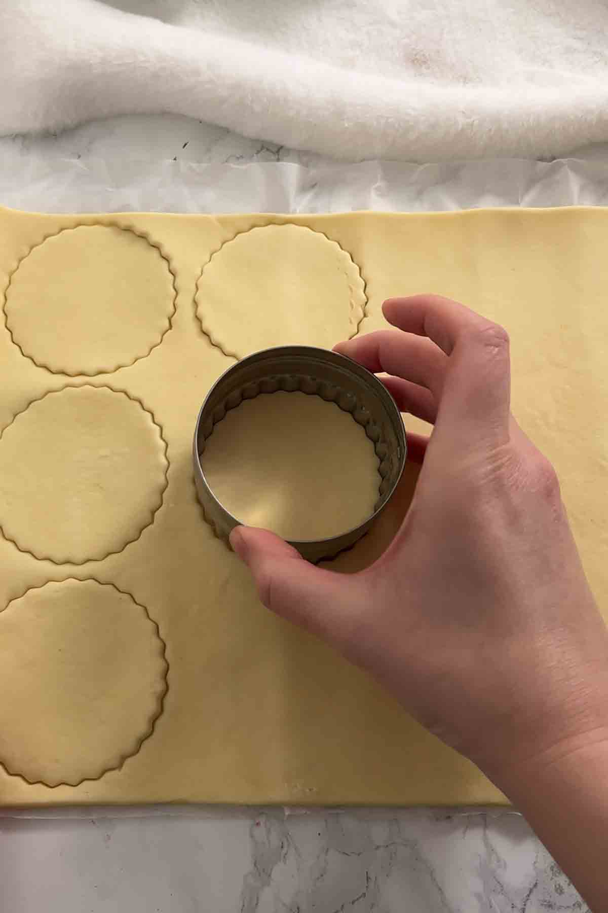 cutting circles out of shortcrust pastry sheet