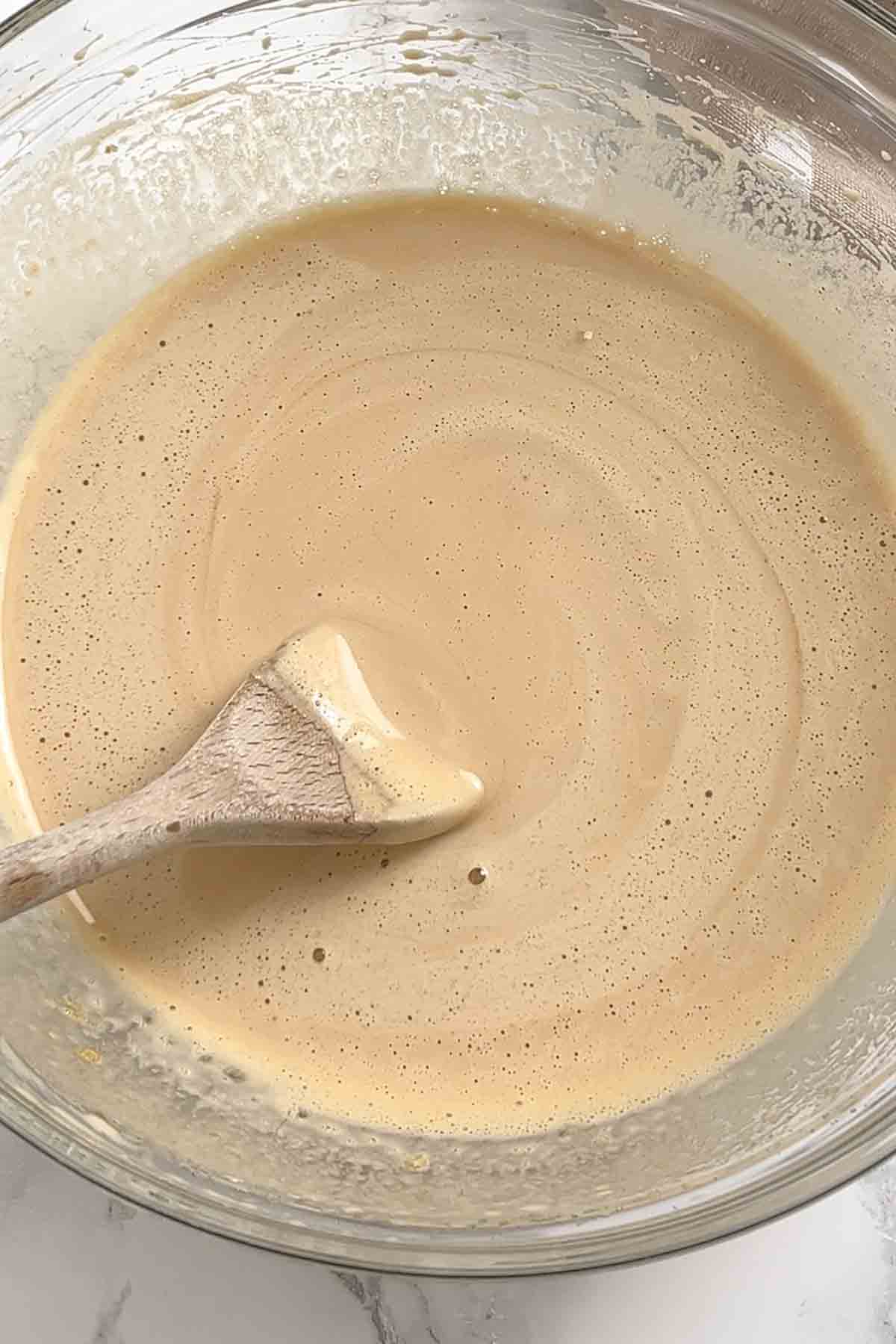 brown sugar and eggs whisked together in a bowl