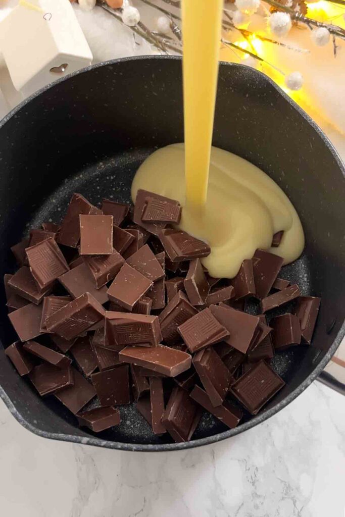 pouring condensed milk into saucepan