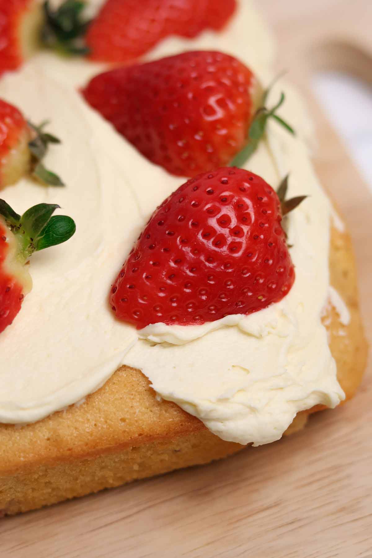 close up of white chocolate strawberry traybake