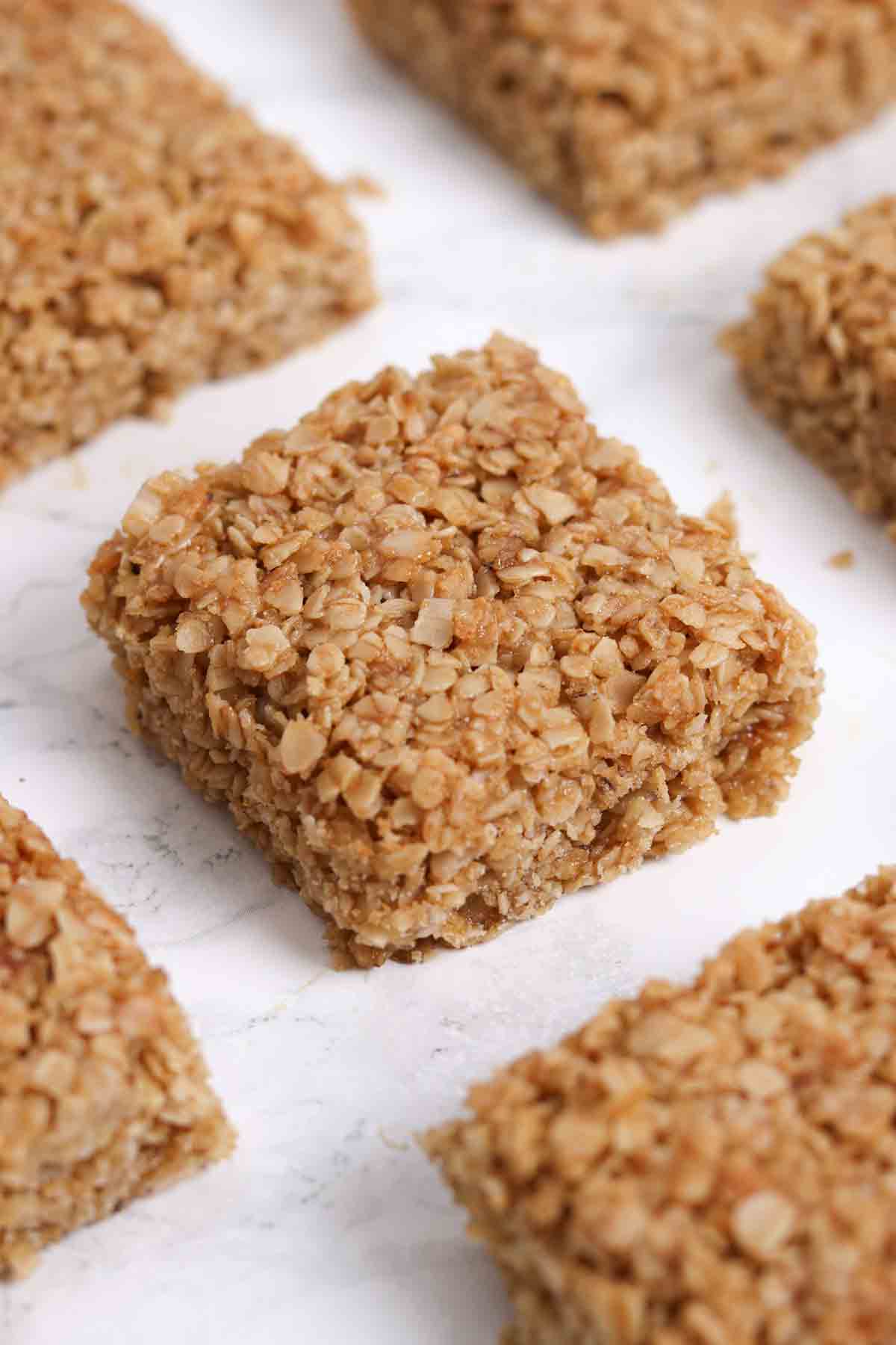 squares of british oat flapjack bars on a white surface