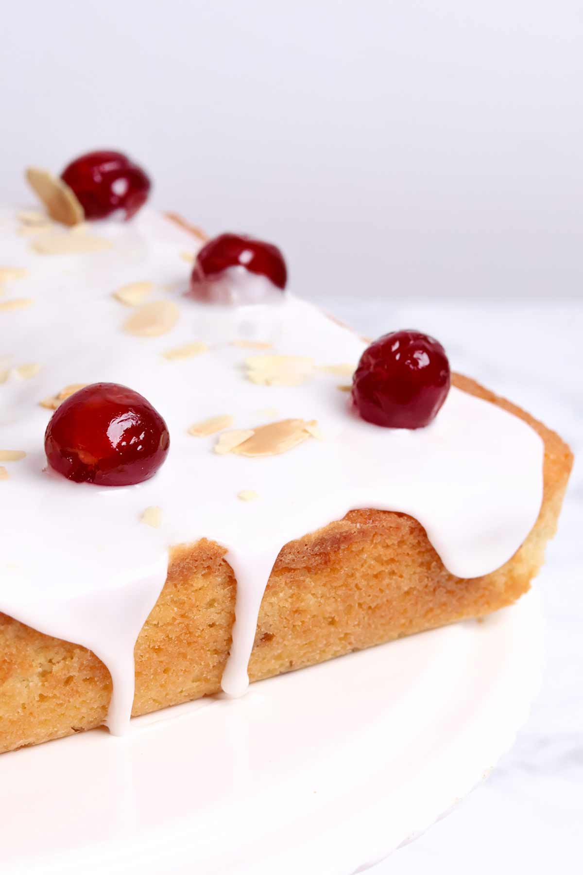 close up of cherry bakewell traybake cake without pastry