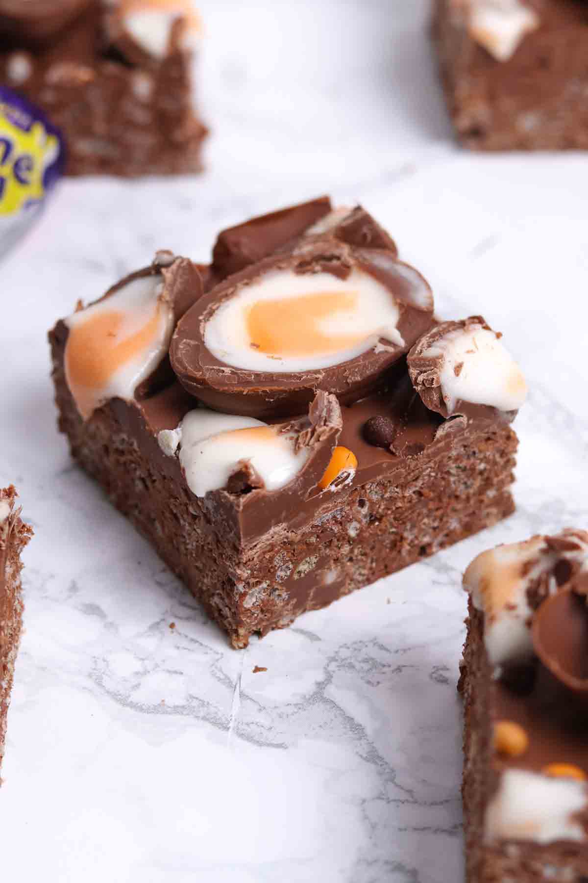 easter creme egg rice krispie treats on a white surface