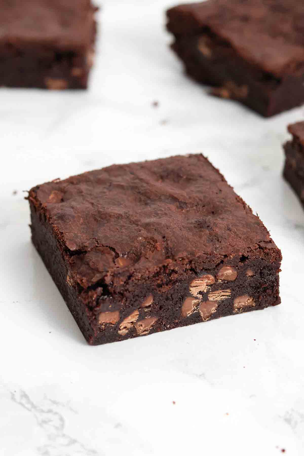 image of squares of chocolate free brownies on a white surface