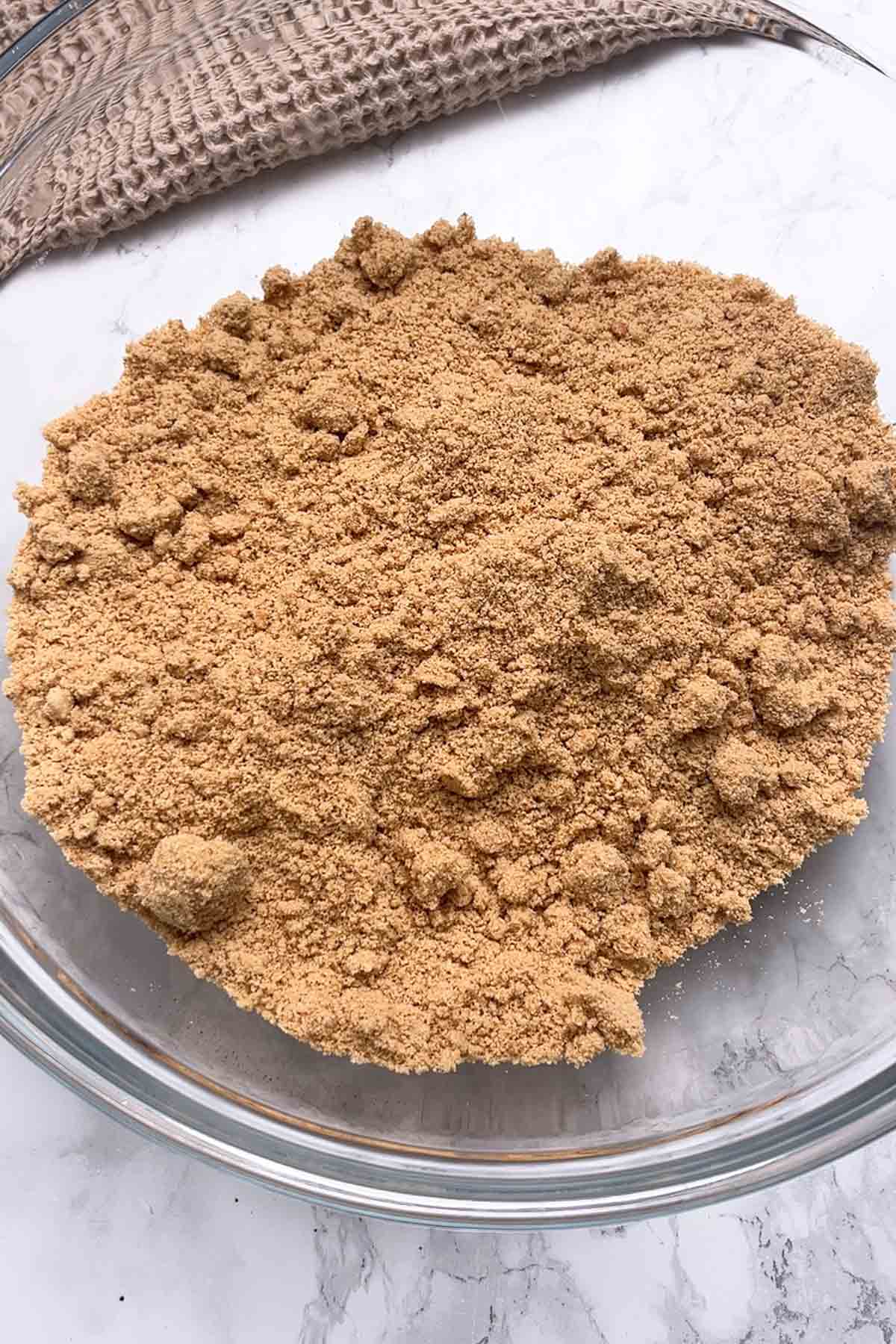 biscuit crumbs in a large glass bowl