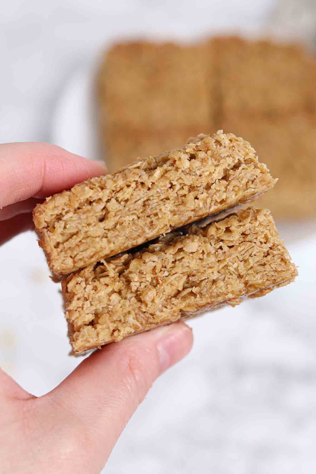 hand holding up two gluten free flapjacks