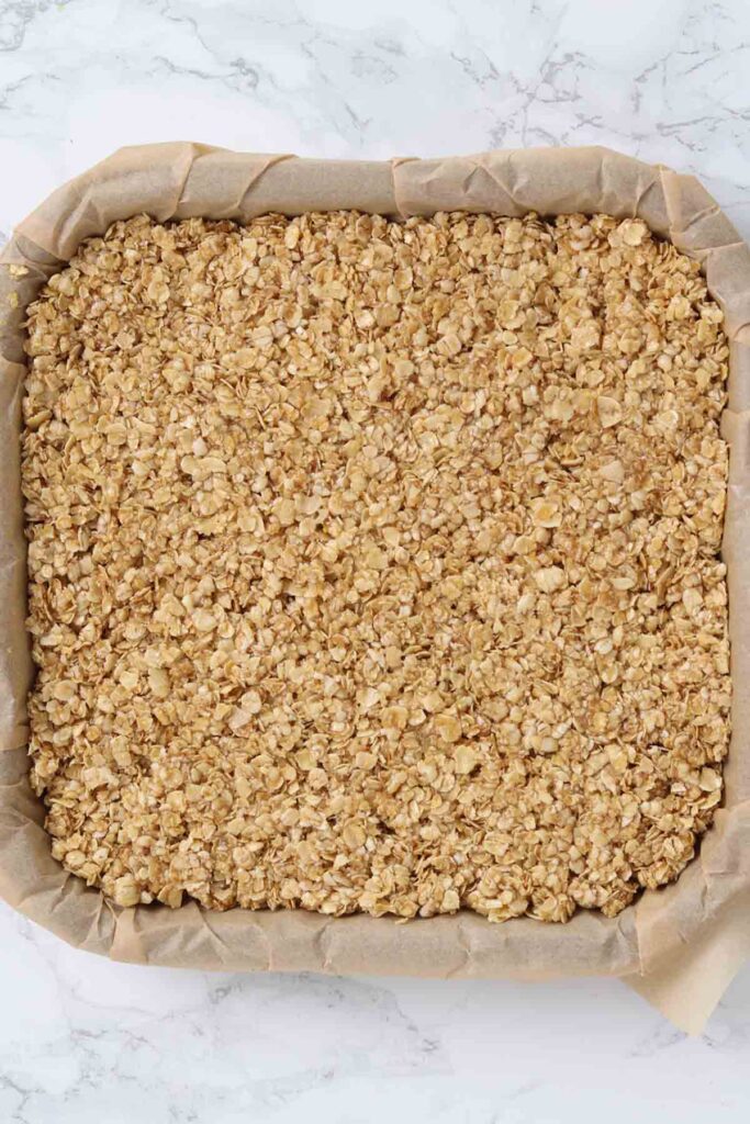oat mixture pressed into lined tin