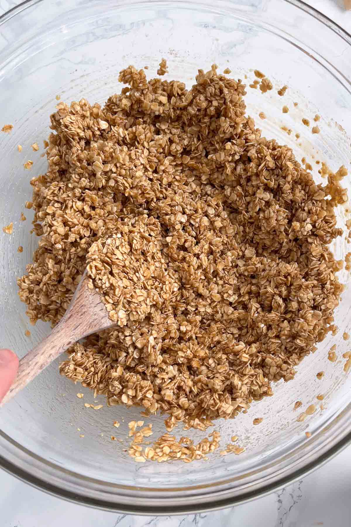 oats mixed with wet mixture in a bowl