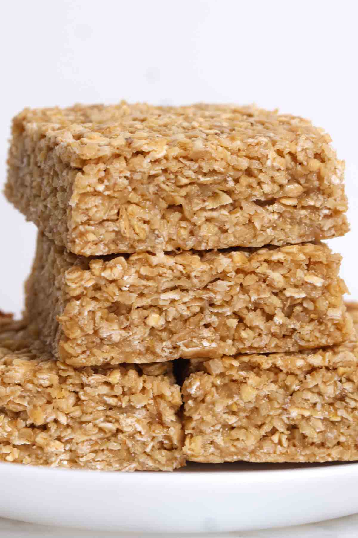 pile of condensed milk flapjacks on a white plate