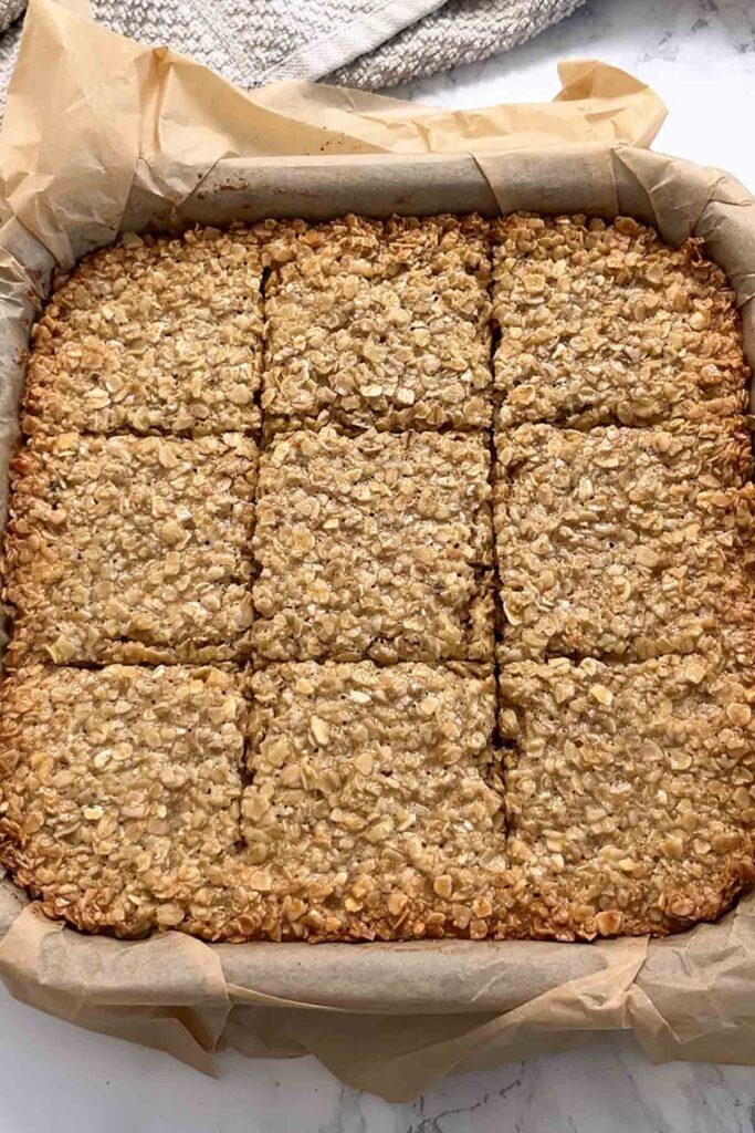 scored flapjack in lined tin