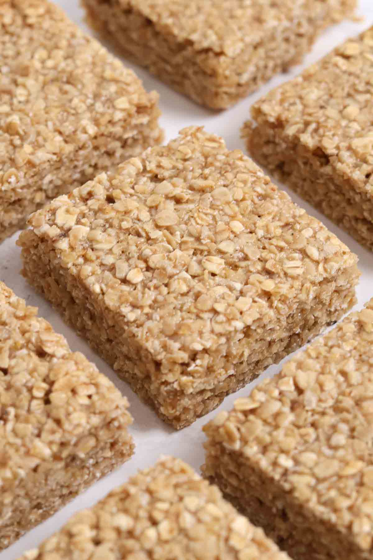 squares of condensed milk flapjacks on a white worktop