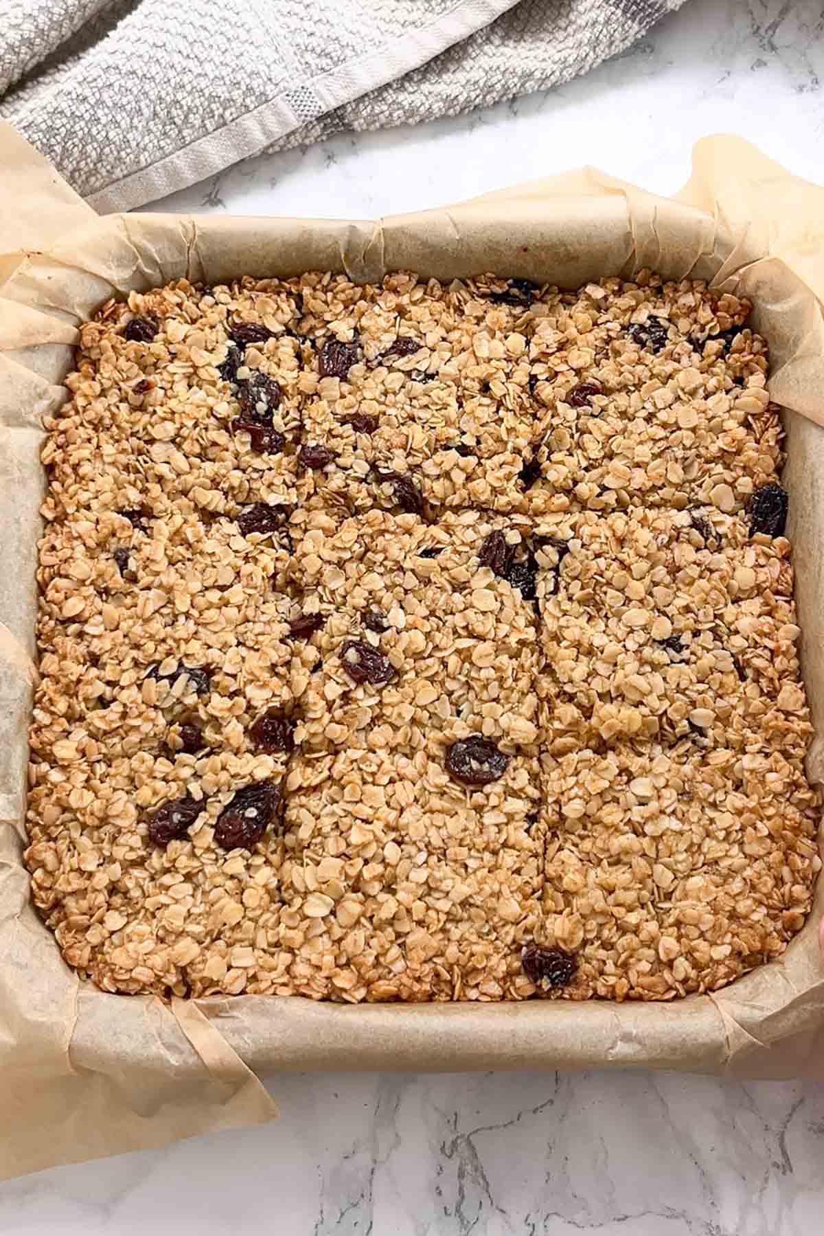 scored baked flapjack in lined tin