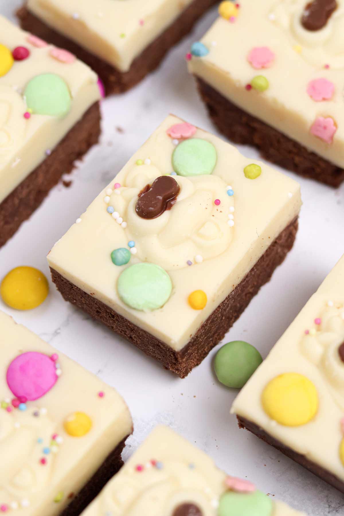 slices of colin the caterpillar chocolate traybake biscuit slice on a white surface
