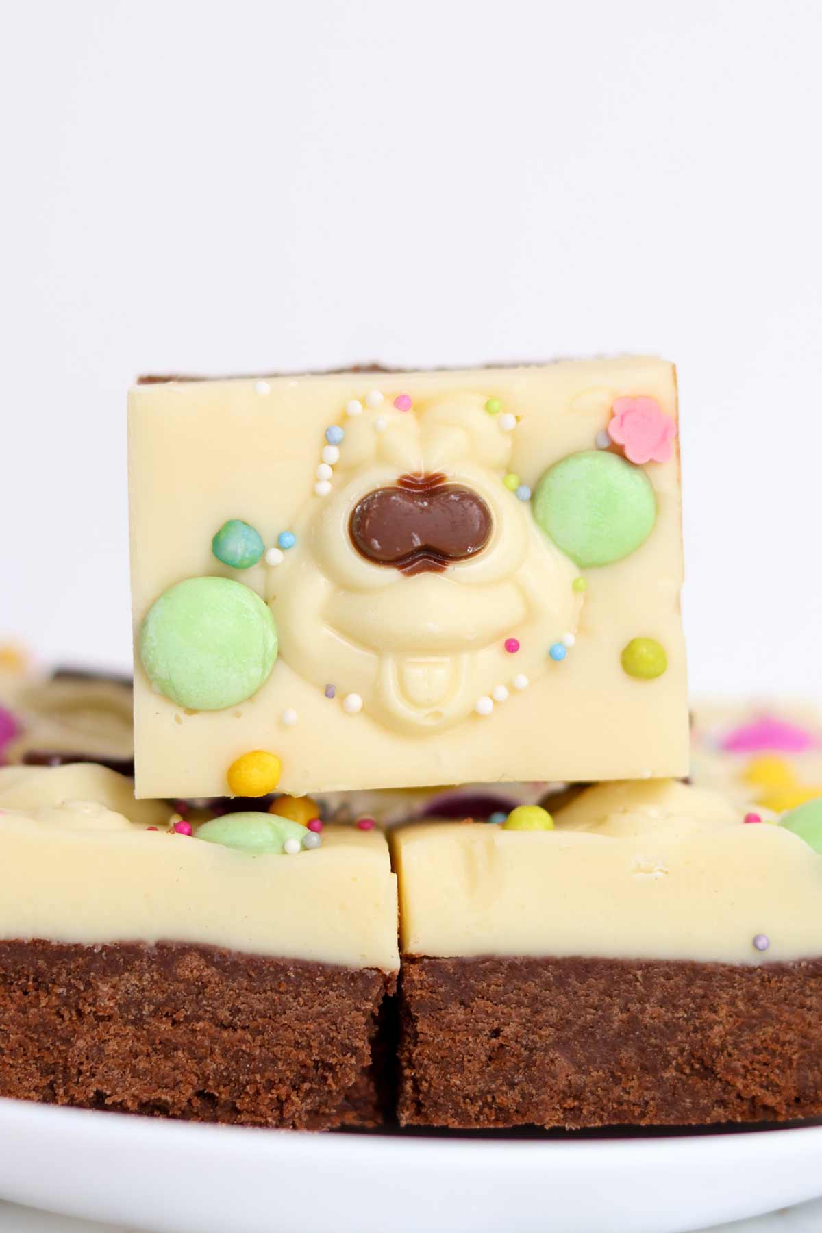 squares of no bake colin the caterpillar traybake slice on a plate