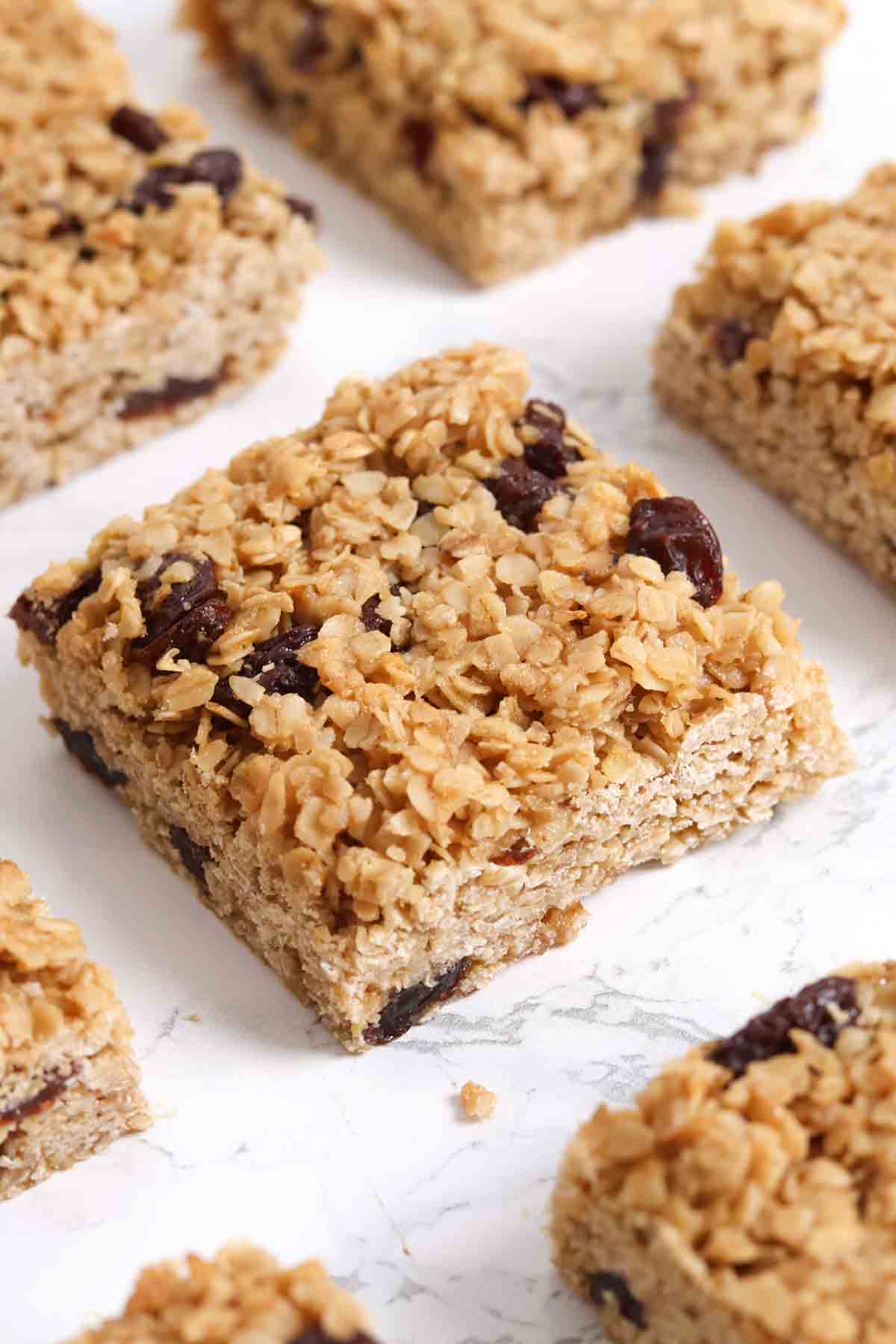 squares of raisin flapjacks on a white worktop