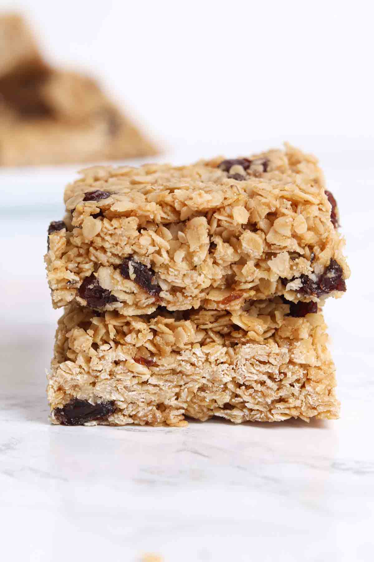 stack of 2 chewy raisin flapjacks on a white surface