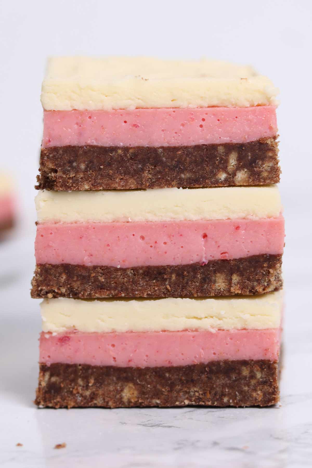 stack of 3 squares of neapolitan traybake