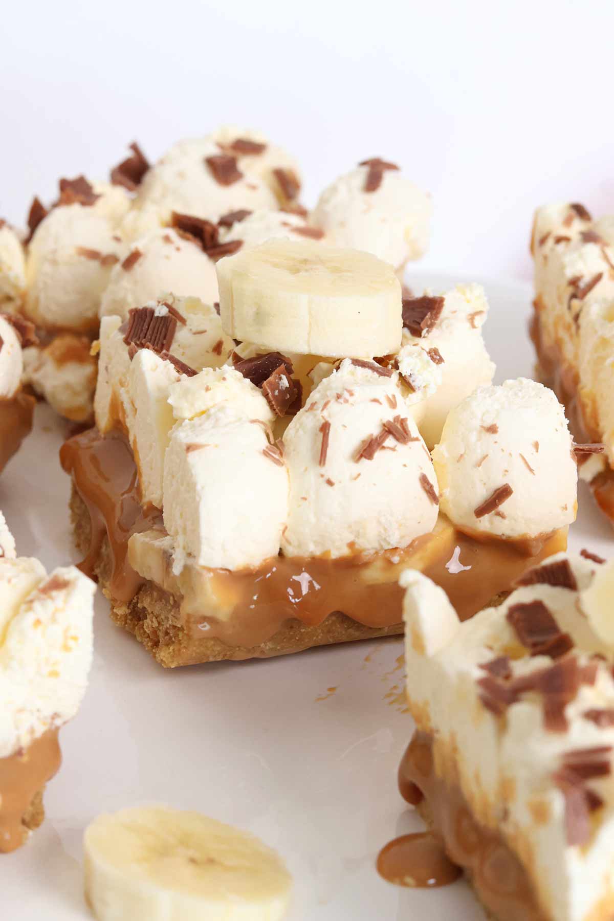 a few banoffee pie traybake bars on a cake stand