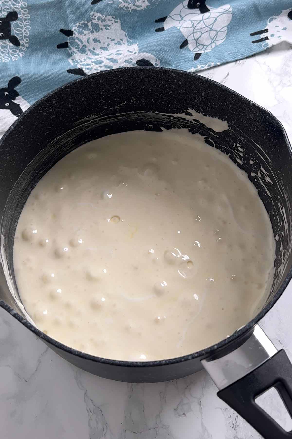 melted marshmallow mixture in a saucepan