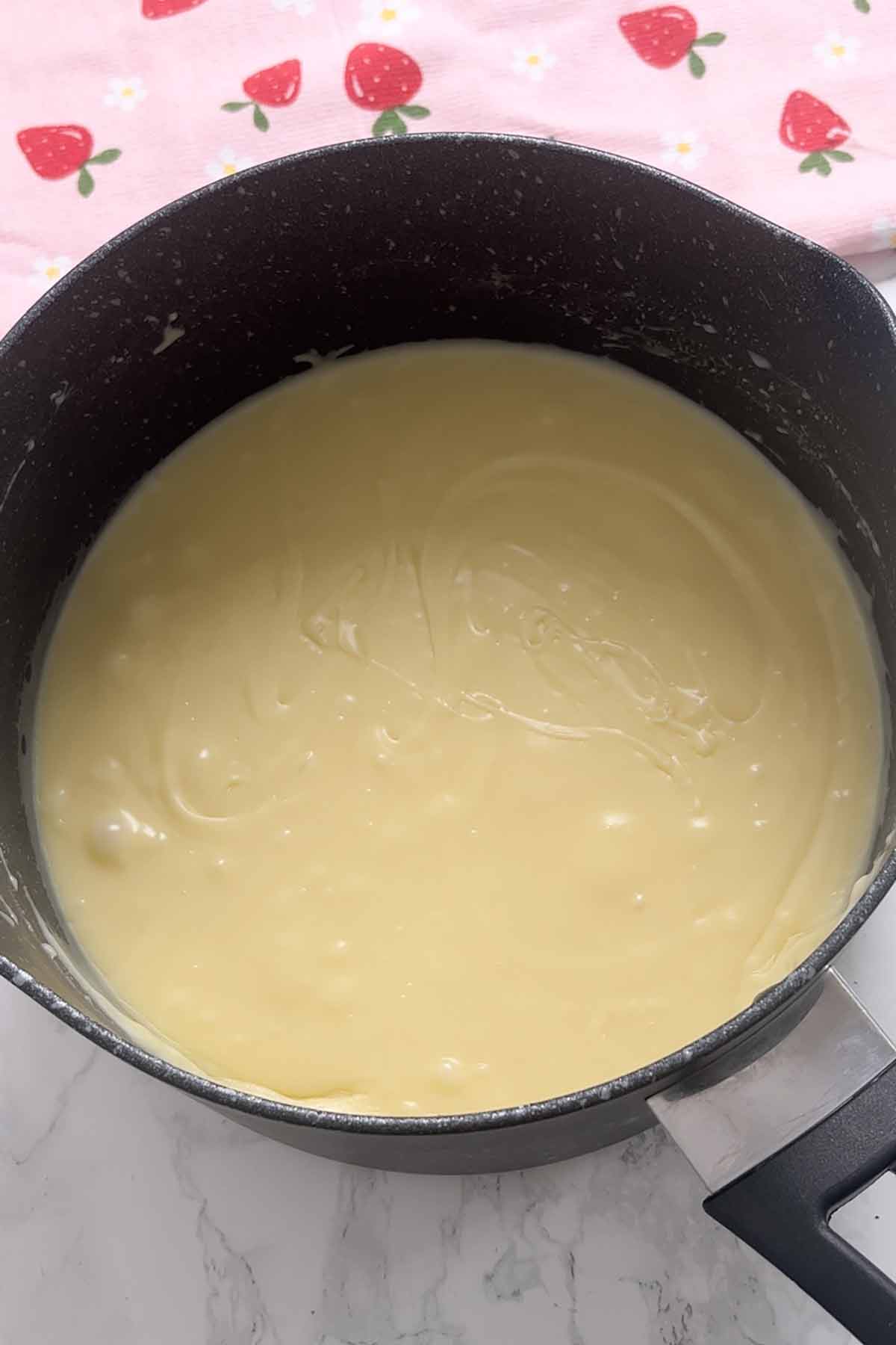 melted white chocolate and condensed milk together in a saucepan
