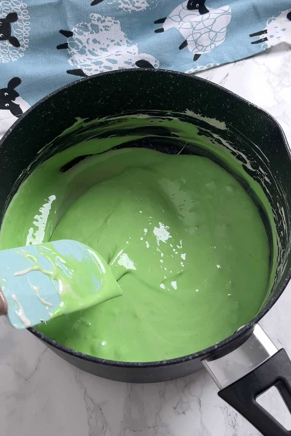 pot of melted green mint marshmallow mixture