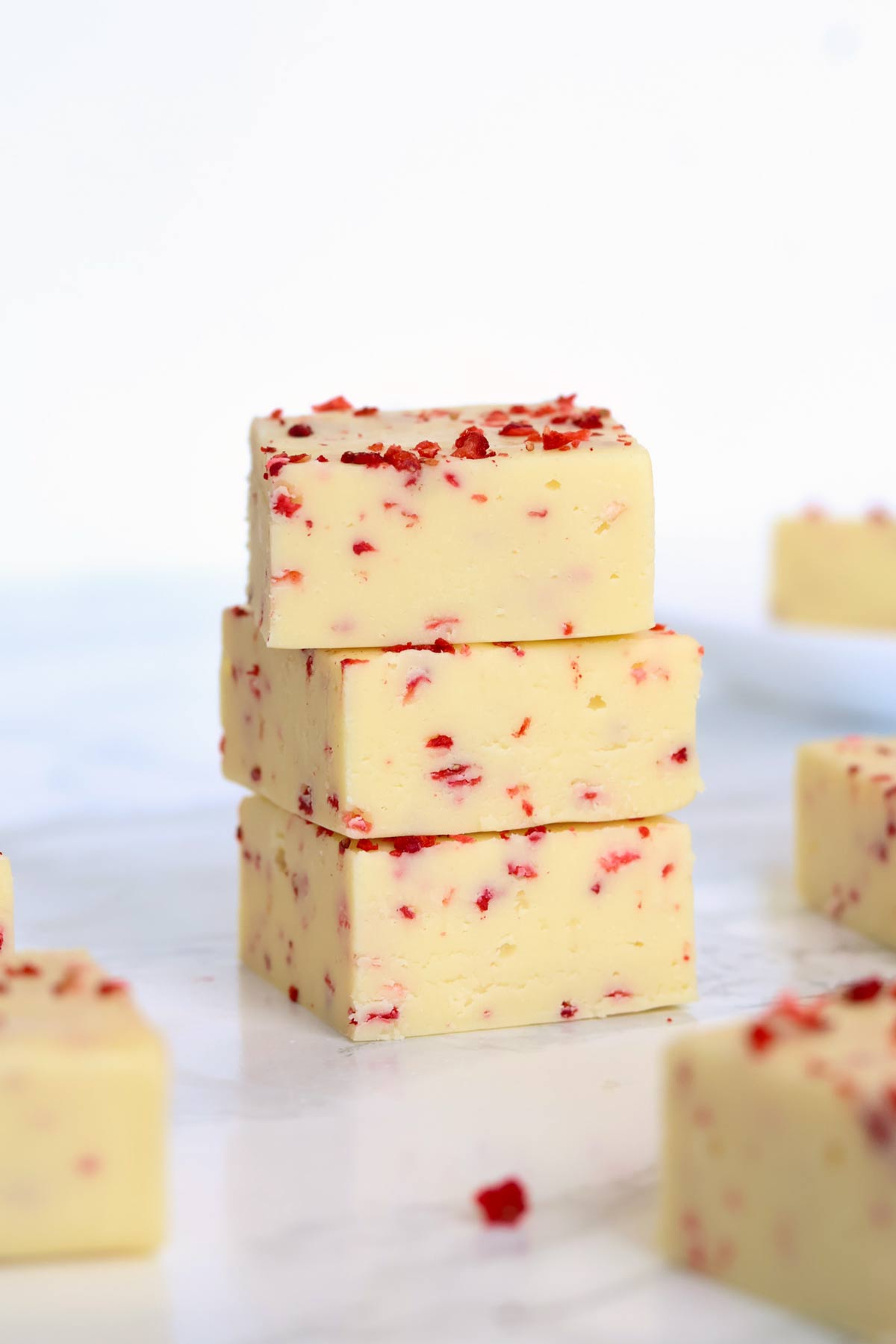 stack of 3 squares of strawberry lemonade fudge