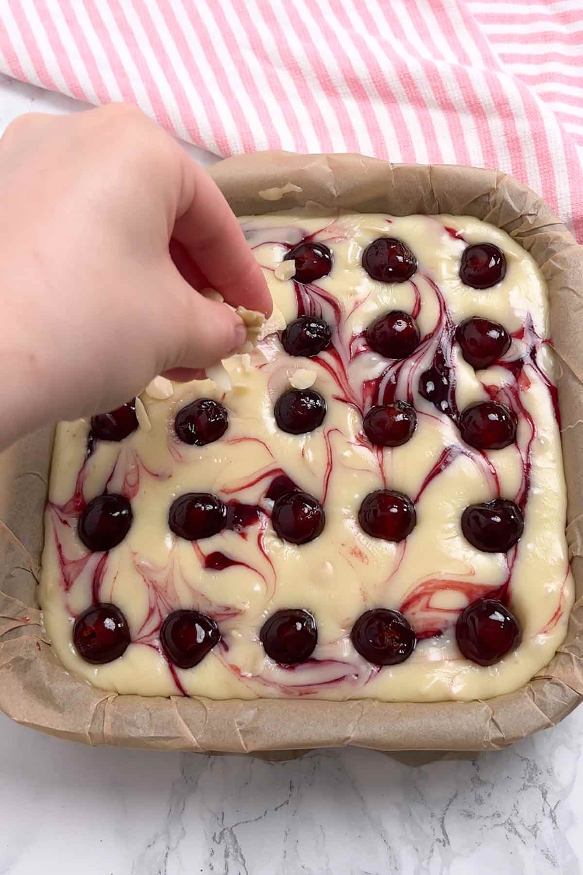 decorating with glace cherries and almonds