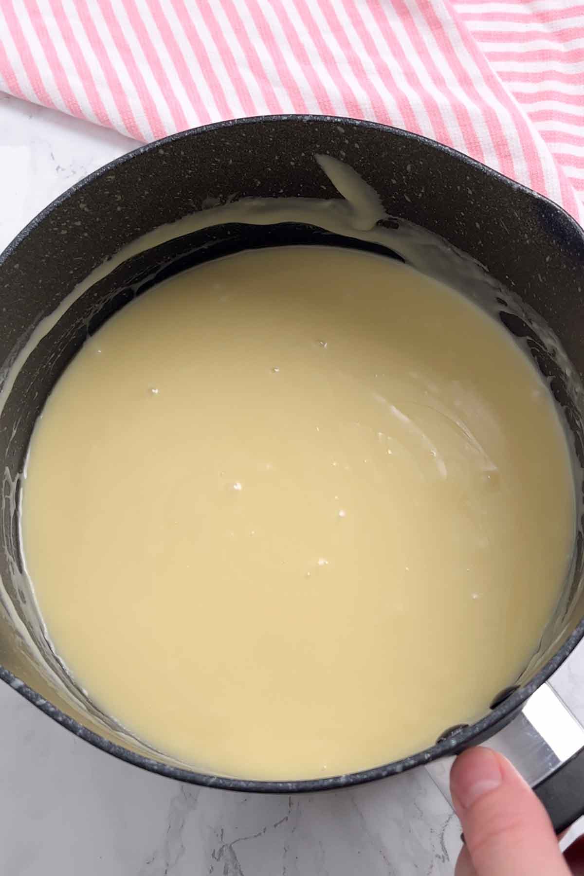 melted fudge mixture in a saucepan