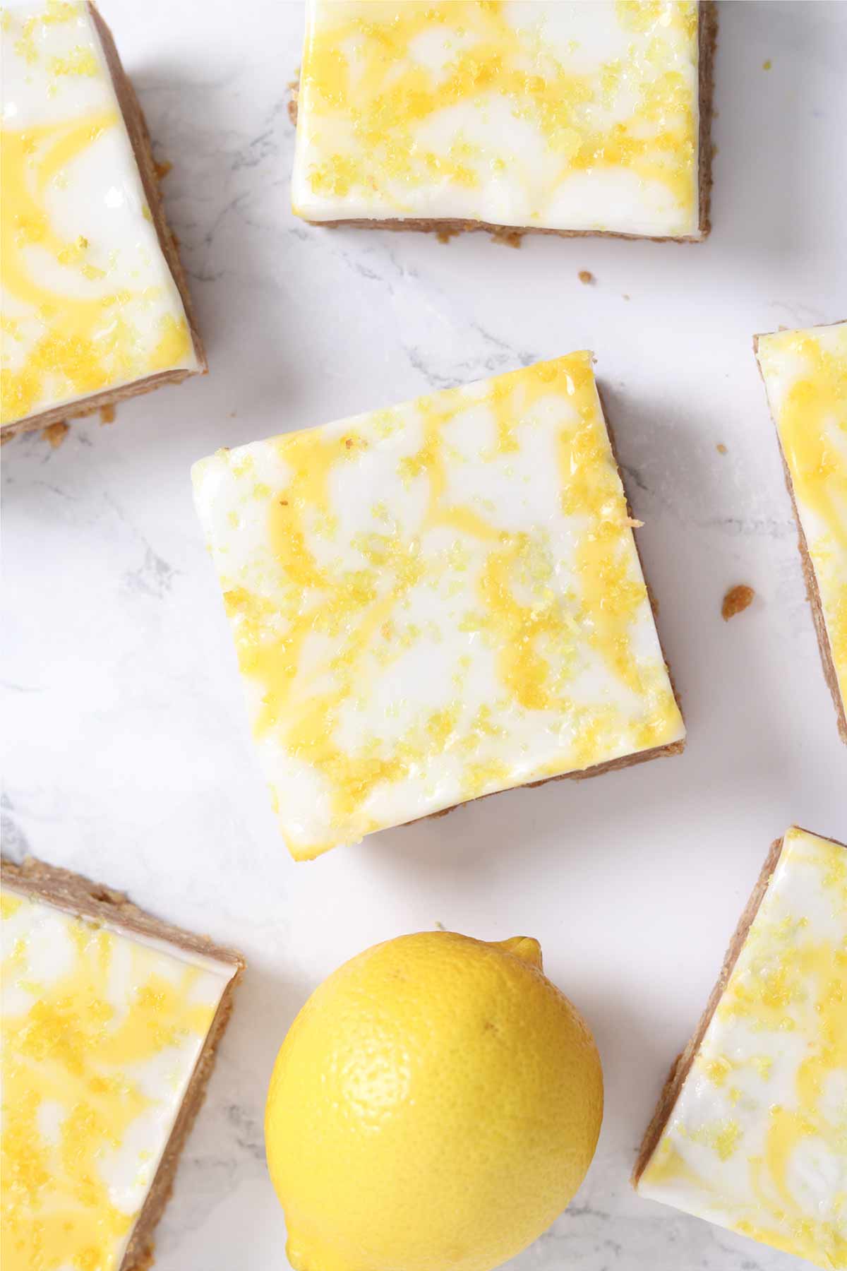 slices of no bake lemon biscuit traybake on a white surface